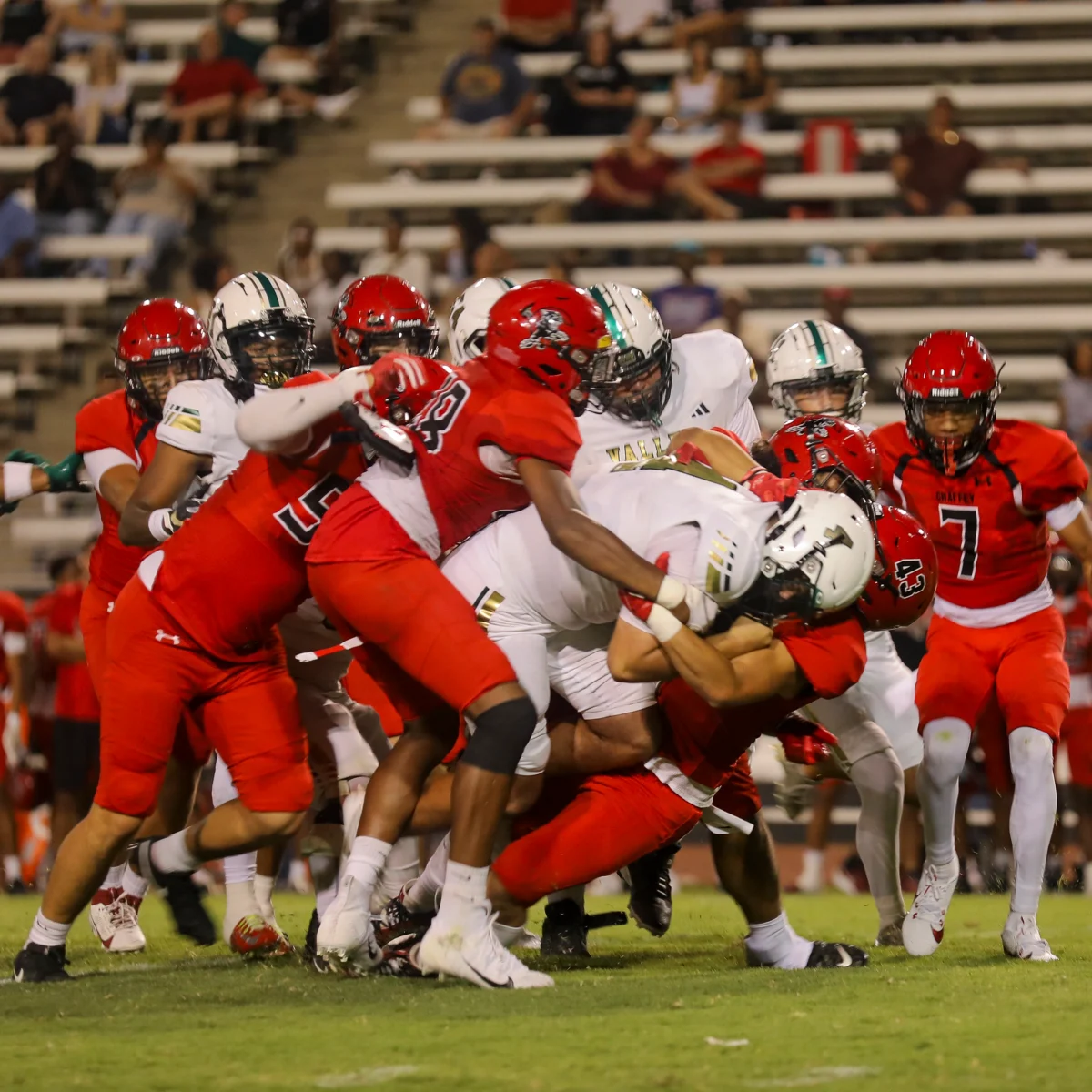 Valley Quarterback Gavin Goulette (4) is tackled by Chaffey football players.