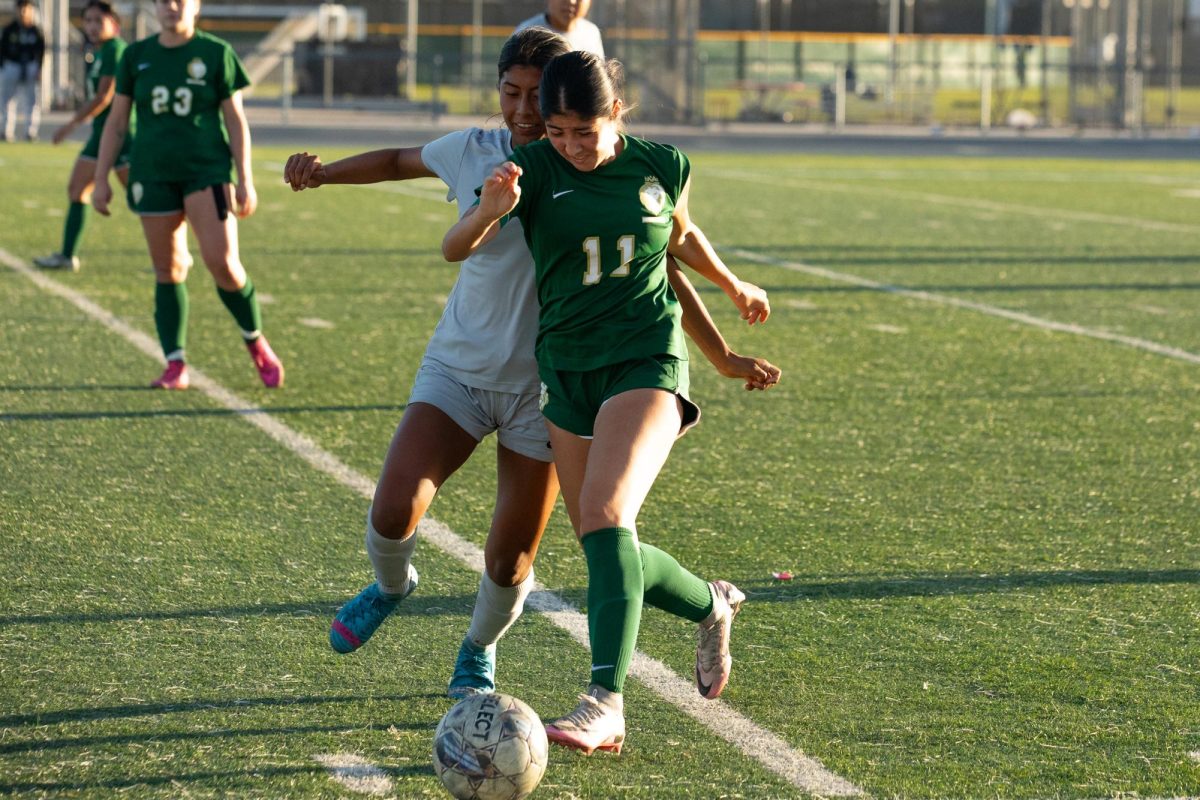 Midfielder Desiree Monge fights for possession against Santa Monica.