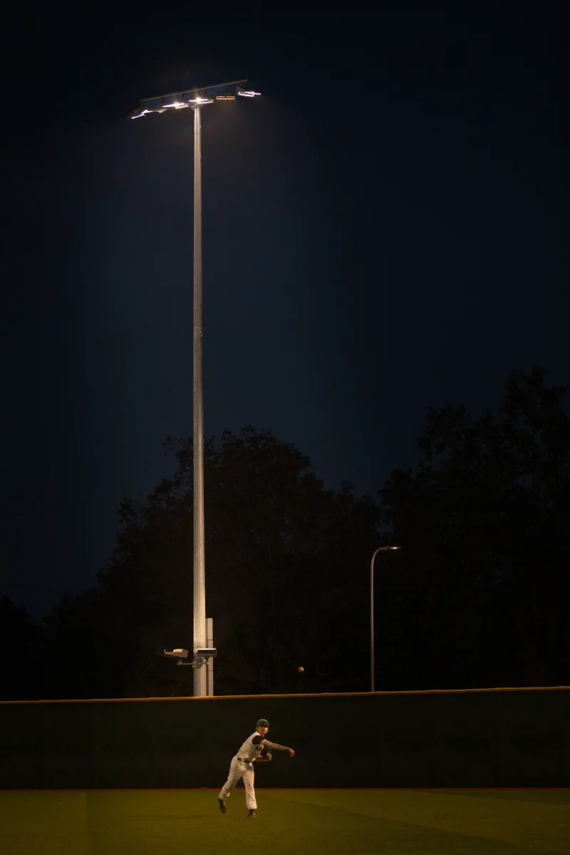 Outfielder Eddie Zapata tosses the ball moments before the beginning of an inning during the first night game. This is Zapata’s last year playing at Valley. (Taylor Cowhey for The Valley Star)